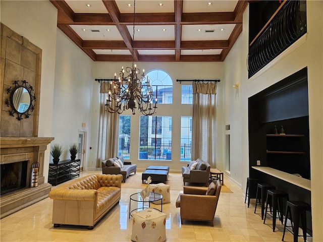 living area with a towering ceiling, beam ceiling, recessed lighting, a chandelier, and coffered ceiling