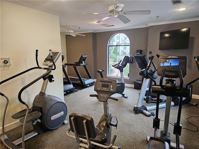 workout area with baseboards, ornamental molding, ceiling fan, and visible vents