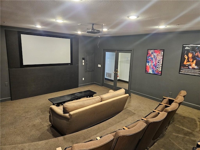 carpeted cinema room featuring french doors, a textured ceiling, visible vents, baseboards, and recessed lighting