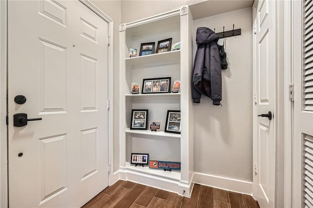 mudroom with baseboards and dark wood-style floors