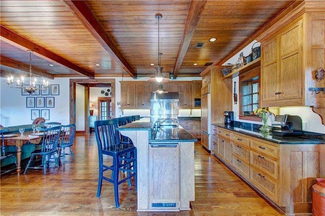 6302 J F Jay Rd, Gainesville, GA 30506 - kitchen with wooden ceiling with exposed beams, a chandelier, a kitchen bar, light wood-style flooring, and decorative light fixtures
