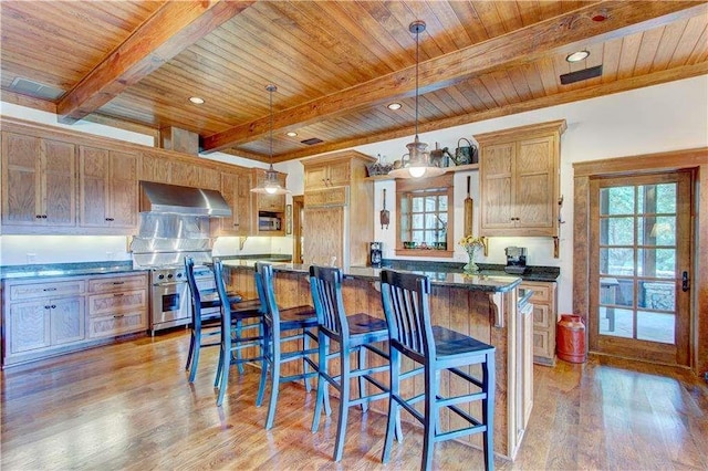 6302 J F Jay Rd, Gainesville, GA 30506 - kitchen featuring dark countertops, wood ceiling with exposed beams, high end stainless steel range, a breakfast bar area, and wall chimney range hood