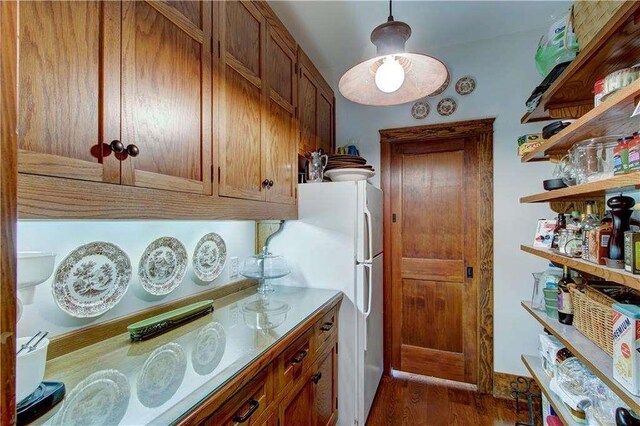 6302 J F Jay Rd, Gainesville, GA 30506 - kitchen with brown cabinets, dark wood-type flooring, and freestanding refrigerator