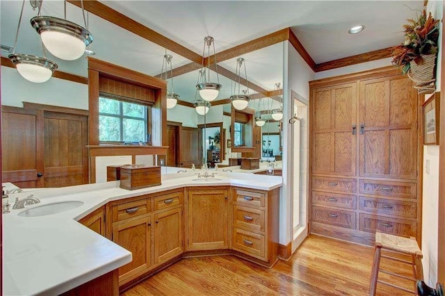 6302 J F Jay Rd, Gainesville, GA 30506 - full bath featuring wood finished floors, double vanity, and ornamental molding