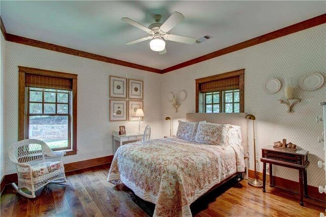6302 J F Jay Rd, Gainesville, GA 30506 - bedroom featuring ornamental molding, wallpapered walls, baseboards, wood finished floors, and multiple windows