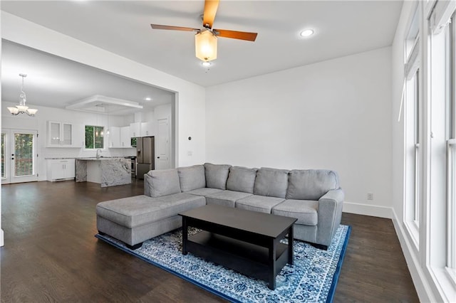482 Pearl Cove Ct, Atlanta, GA 30350 - living area featuring dark wood finished floors, a chandelier, a ceiling fan, recessed lighting, and baseboards