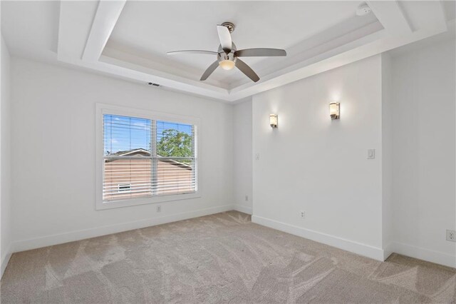 482 Pearl Cove Ct, Atlanta, GA 30350 - empty room featuring a tray ceiling, light carpet, a ceiling fan, and baseboards