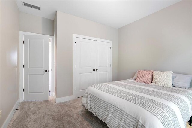 482 Pearl Cove Ct, Atlanta, GA 30350 - bedroom featuring carpet floors, a closet, and baseboards