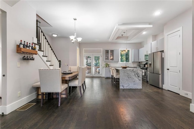482 Pearl Cove Ct, Atlanta, GA 30350 - dining room featuring a chandelier, french doors, dark wood-style floors, stairs, and baseboards