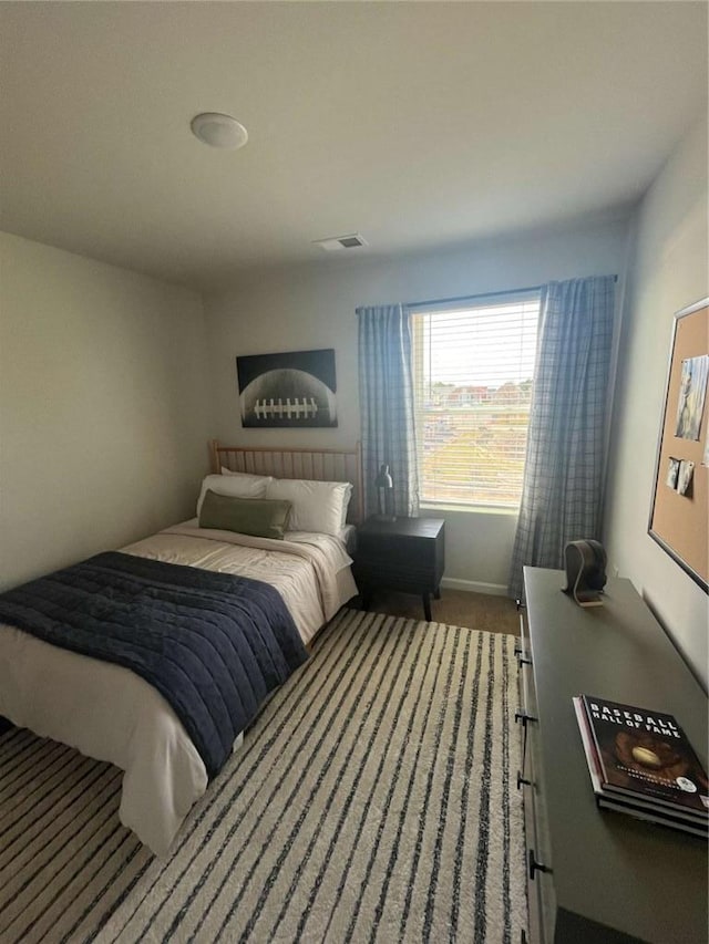 bedroom with carpet flooring and visible vents