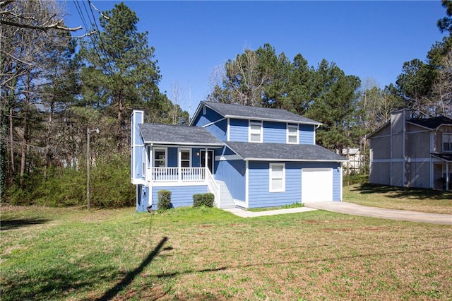 view of front facade featuring a garage, a porch, and a front yard