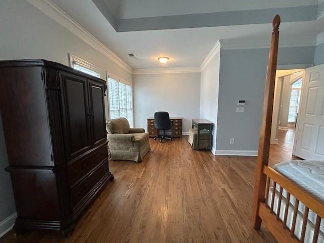 sitting room with baseboards, ornamental molding, and wood finished floors