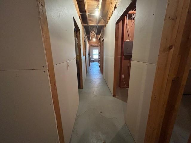 hallway with concrete floors