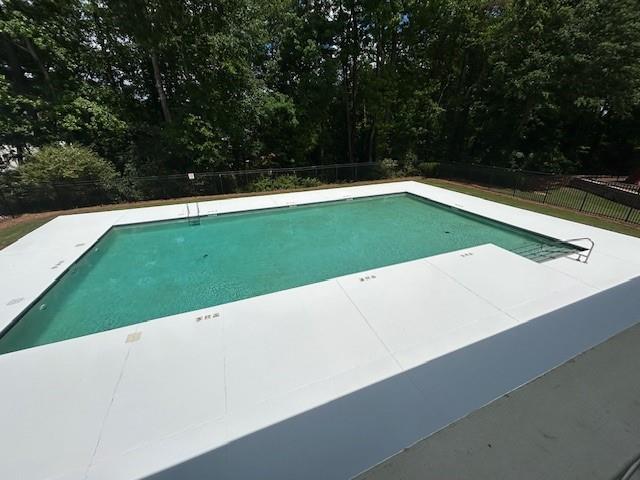 view of pool with a patio area, a fenced in pool, and a fenced backyard