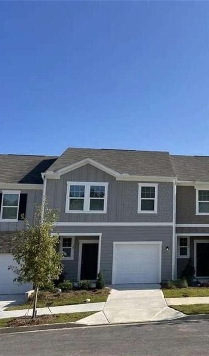 283 Rydal Way, Winder, GA 30680 - view of front facade featuring driveway and a garage