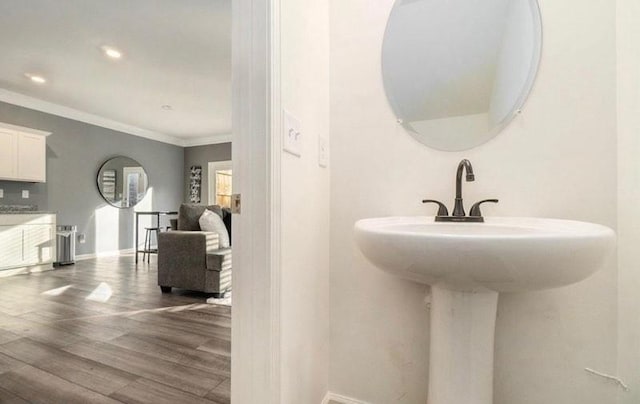 283 Rydal Way, Winder, GA 30680 - bathroom with wood finished floors, crown molding, and recessed lighting