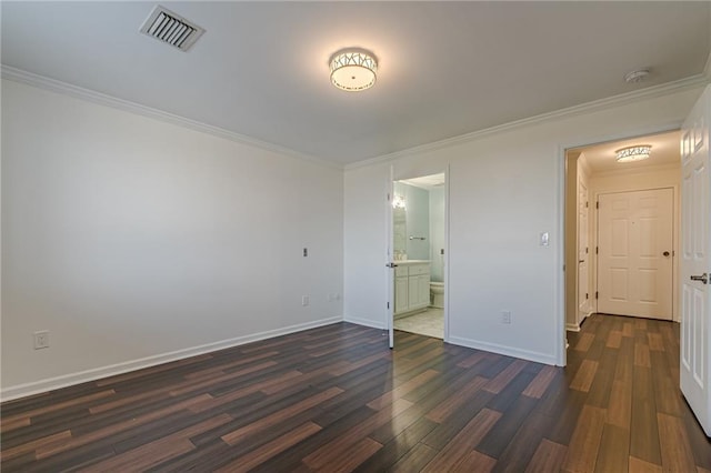 unfurnished bedroom featuring ensuite bathroom, dark hardwood / wood-style flooring, and ornamental molding