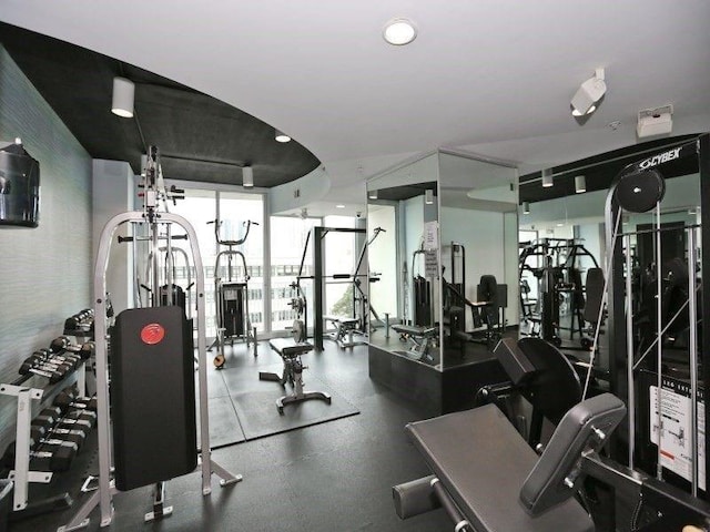 exercise room with floor to ceiling windows