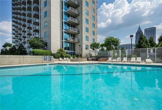 community pool featuring fence