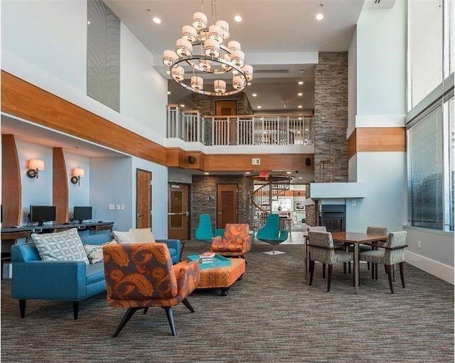 common area with a towering ceiling and recessed lighting