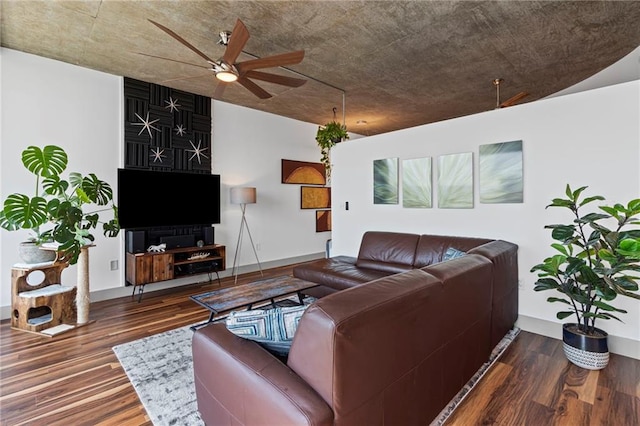 living area with ceiling fan, wood finished floors, and baseboards