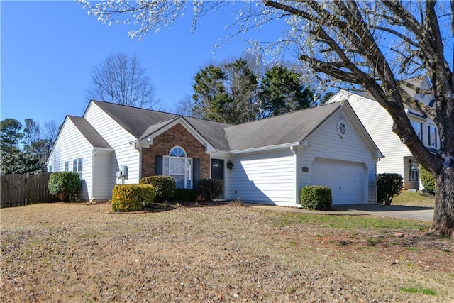 ranch-style home with brick siding, driveway, an attached garage, and fence