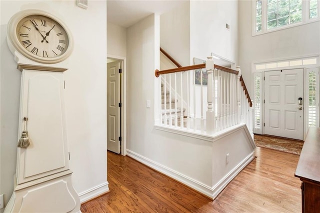4401 Madison Woods Dr NW, Marietta, GA 30064 - foyer with light wood finished floors and stairs