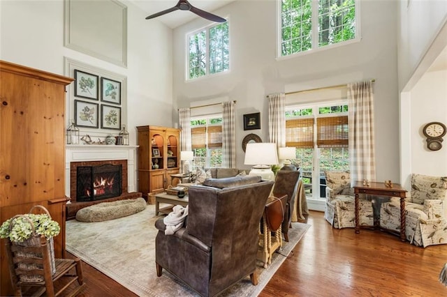 4401 Madison Woods Dr NW, Marietta, GA 30064 - living room with ceiling fan, a high ceiling, a fireplace, and wood finished floors