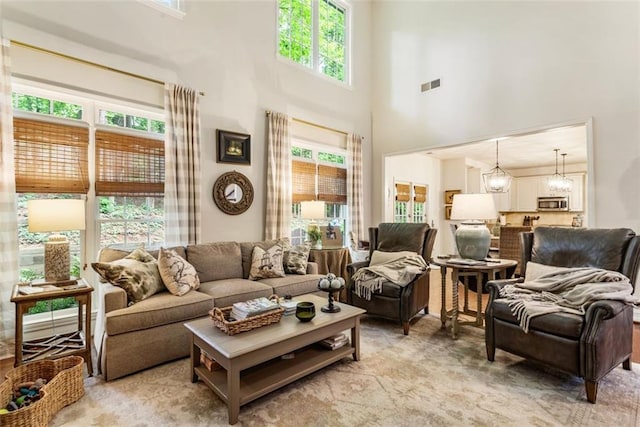 4401 Madison Woods Dr NW, Marietta, GA 30064 - living room featuring a high ceiling and a chandelier