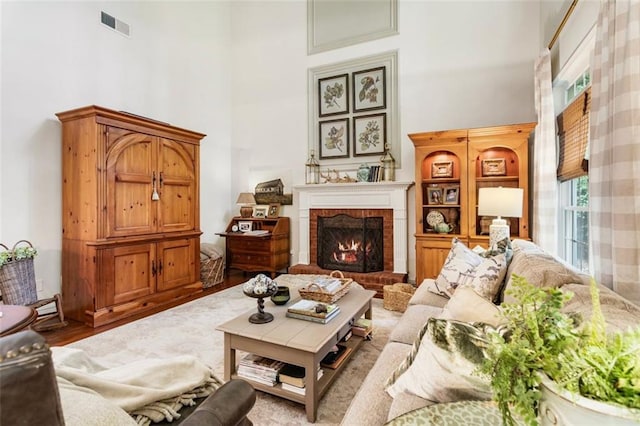 4401 Madison Woods Dr NW, Marietta, GA 30064 - living room featuring a towering ceiling, a fireplace, and wood finished floors