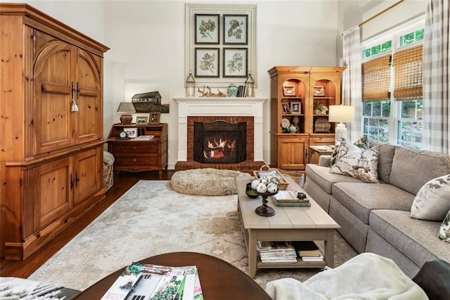 4401 Madison Woods Dr NW, Marietta, GA 30064 - living area with dark wood-style flooring, a fireplace, and a towering ceiling