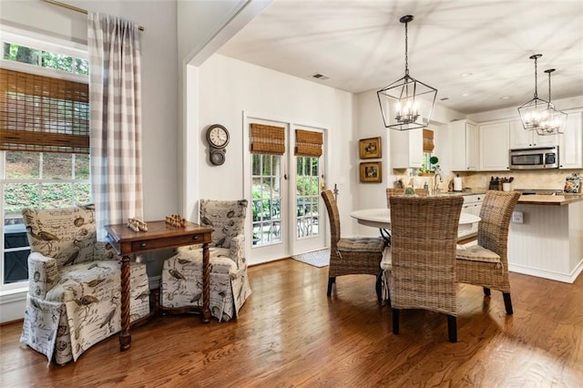 4401 Madison Woods Dr NW, Marietta, GA 30064 - dining room with wood finished floors and a chandelier