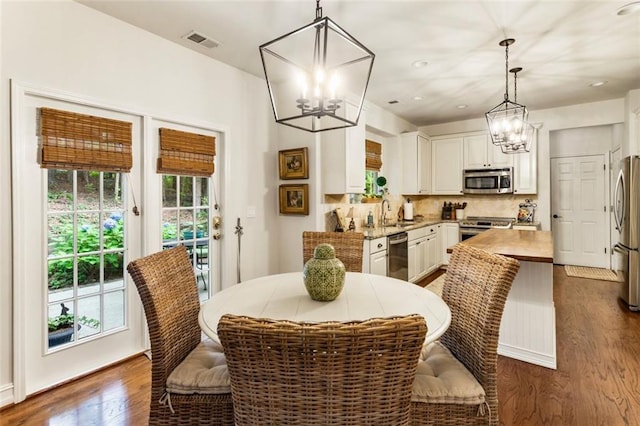 4401 Madison Woods Dr NW, Marietta, GA 30064 - dining space featuring a chandelier, plenty of natural light, dark wood-type flooring, and recessed lighting