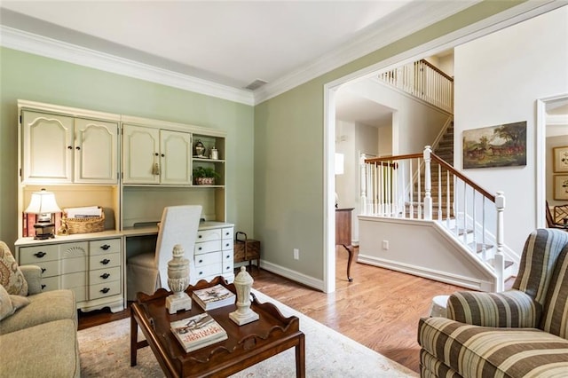 4401 Madison Woods Dr NW, Marietta, GA 30064 - living area featuring crown molding, stairway, and light wood-style flooring