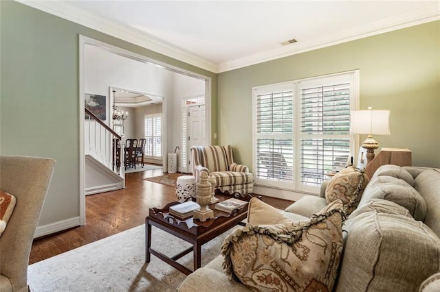 4401 Madison Woods Dr NW, Marietta, GA 30064 - living room featuring crown molding, stairs, wood finished floors, and a chandelier