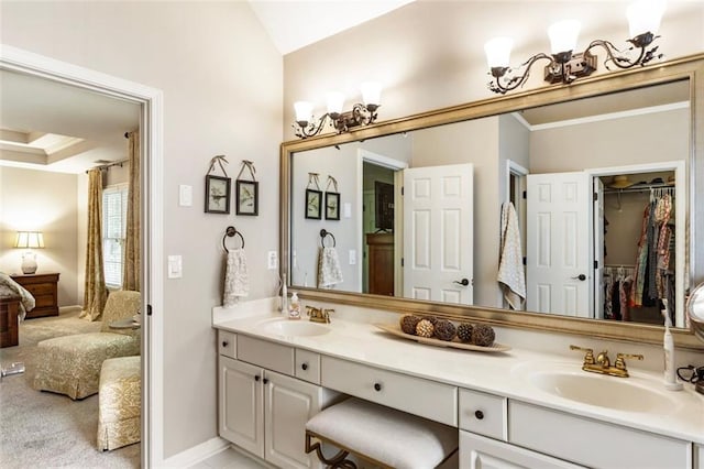 4401 Madison Woods Dr NW, Marietta, GA 30064 - ensuite bathroom featuring double vanity, a spacious closet, crown molding, and vaulted ceiling