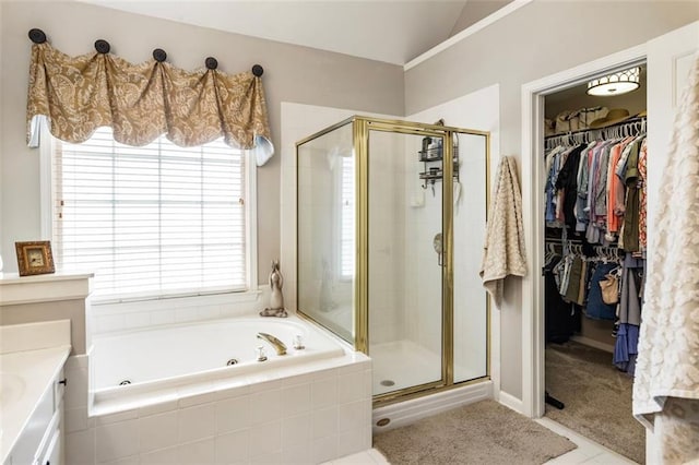 4401 Madison Woods Dr NW, Marietta, GA 30064 - bathroom featuring a jetted tub, a shower stall, vaulted ceiling, a spacious closet, and vanity