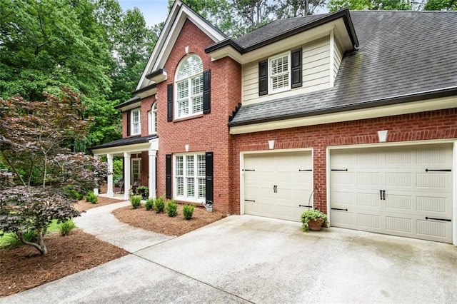 4401 Madison Woods Dr NW, Marietta, GA 30064 - view of front of property featuring brick siding, driveway, and a shingled roof