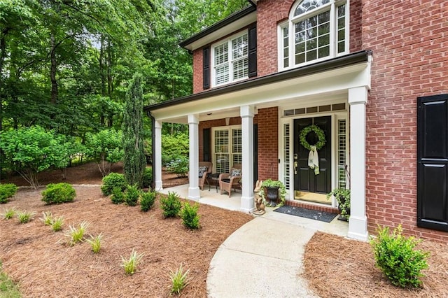 4401 Madison Woods Dr NW, Marietta, GA 30064 - view of exterior entry with covered porch and brick siding