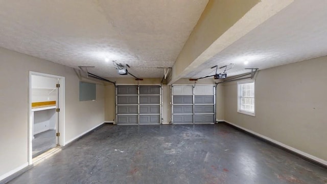 garage featuring baseboards and a garage door opener