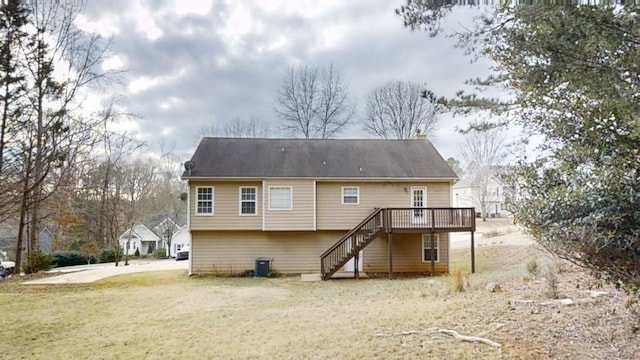 rear view of house featuring a yard, stairway, cooling unit, and a wooden deck