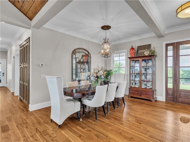 702 Cash Rd NE, Calhoun, GA 30701 - dining room featuring a chandelier, light wood-style floors, and crown molding