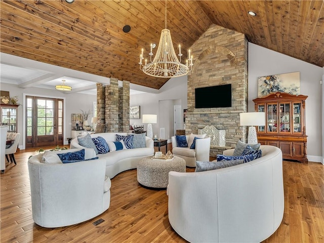 702 Cash Rd NE, Calhoun, GA 30701 - living room with a chandelier, ornate columns, wooden ceiling, light wood finished floors, and high vaulted ceiling