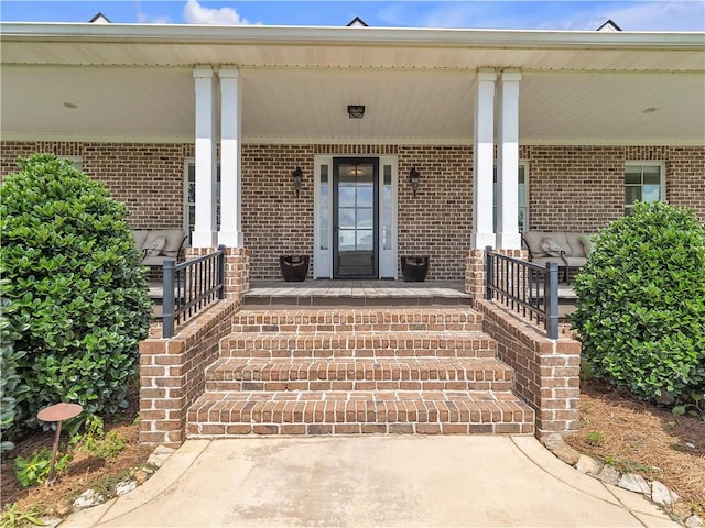 702 Cash Rd NE, Calhoun, GA 30701 - entrance to property featuring covered porch and brick siding
