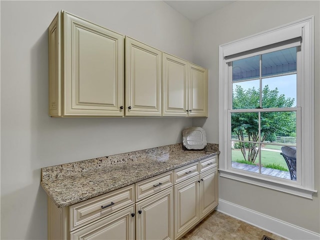 702 Cash Rd NE, Calhoun, GA 30701 - kitchen with cream cabinetry and light stone counters