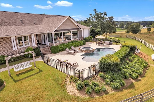 702 Cash Rd NE, Calhoun, GA 30701 - back of house with an outdoor fire pit, a patio, a fenced backyard, and brick siding