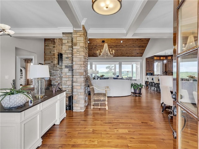 702 Cash Rd NE, Calhoun, GA 30701 - entryway featuring ornamental molding, a chandelier, and light wood-style flooring