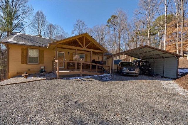 view of front of house featuring crawl space, driveway, a shingled roof, and a carport