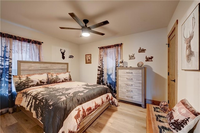 bedroom featuring light hardwood / wood-style floors and ceiling fan