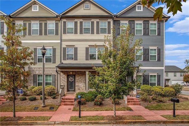 multi unit property featuring brick siding